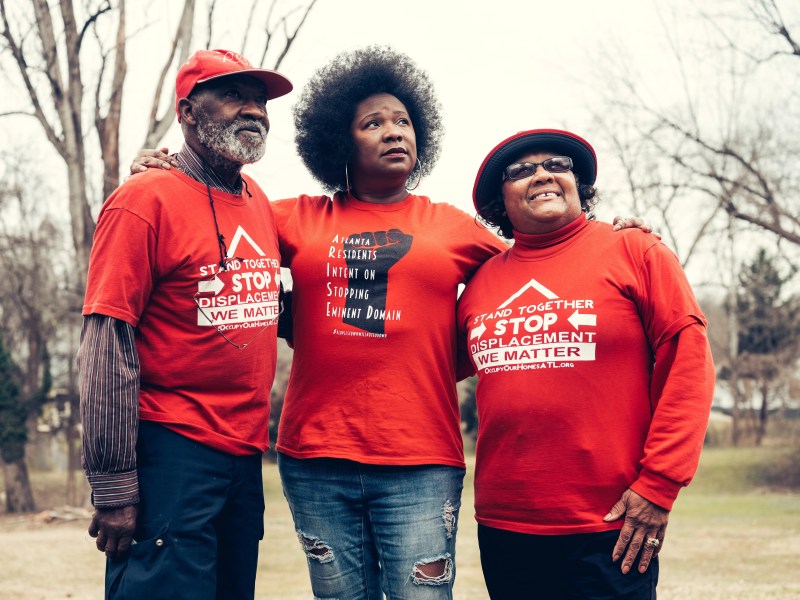 Robert Darden (left), Tanya Washington Hicks (center), and Bertha Darden standing next to each other in Peoplestown. (Aboubacar Kante)