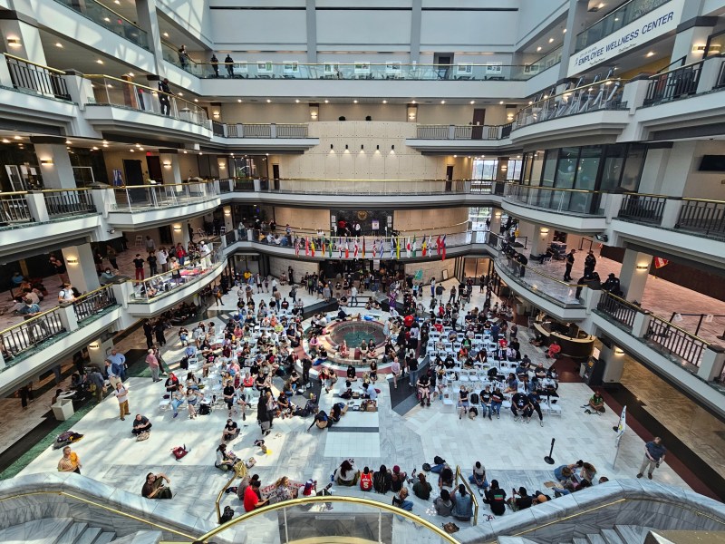 A photo of the Atlanta City Hall atrium, packed with people.