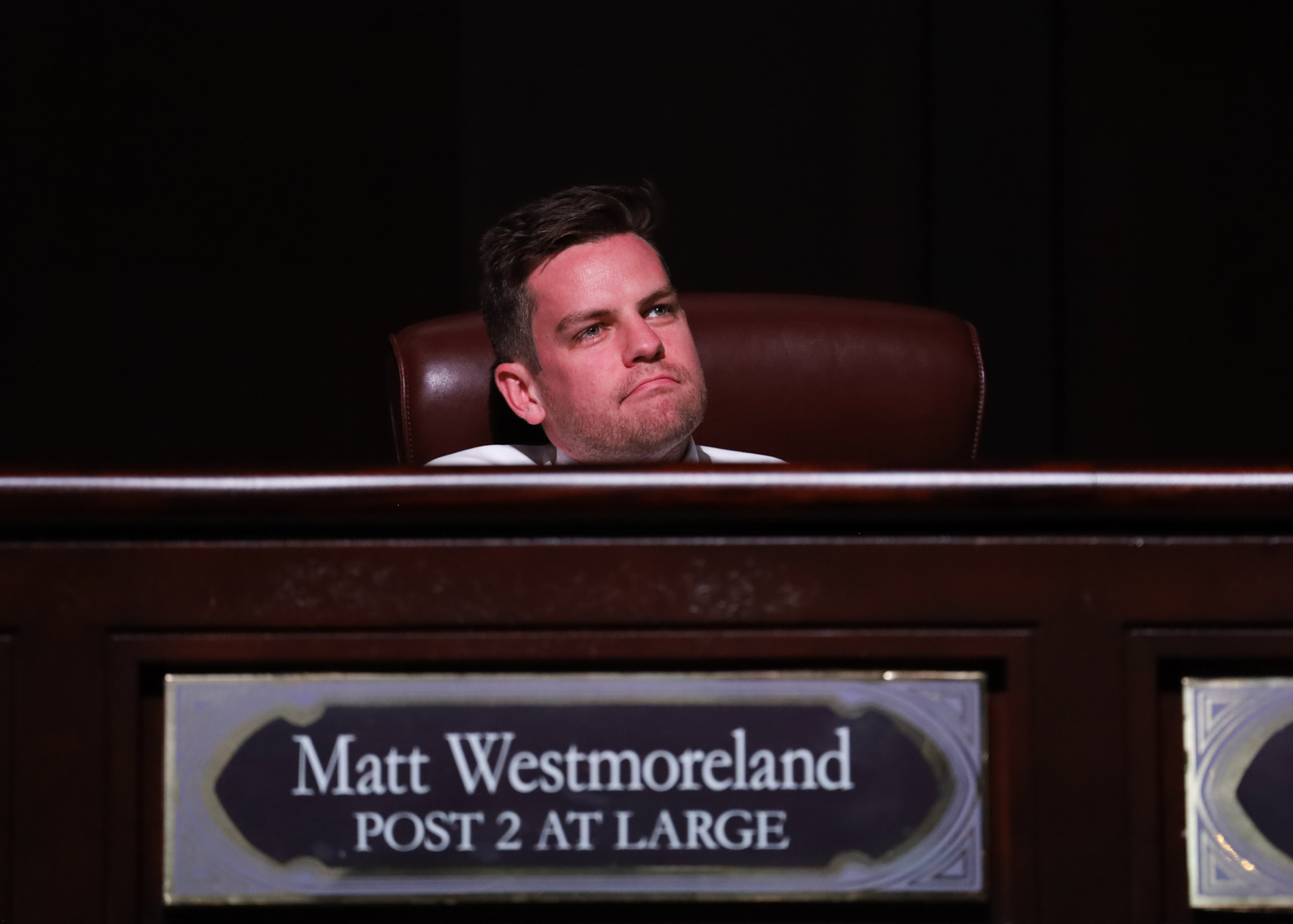 A photograph of Matt Westmoreland sitting in the Atlanta City Council chambers.