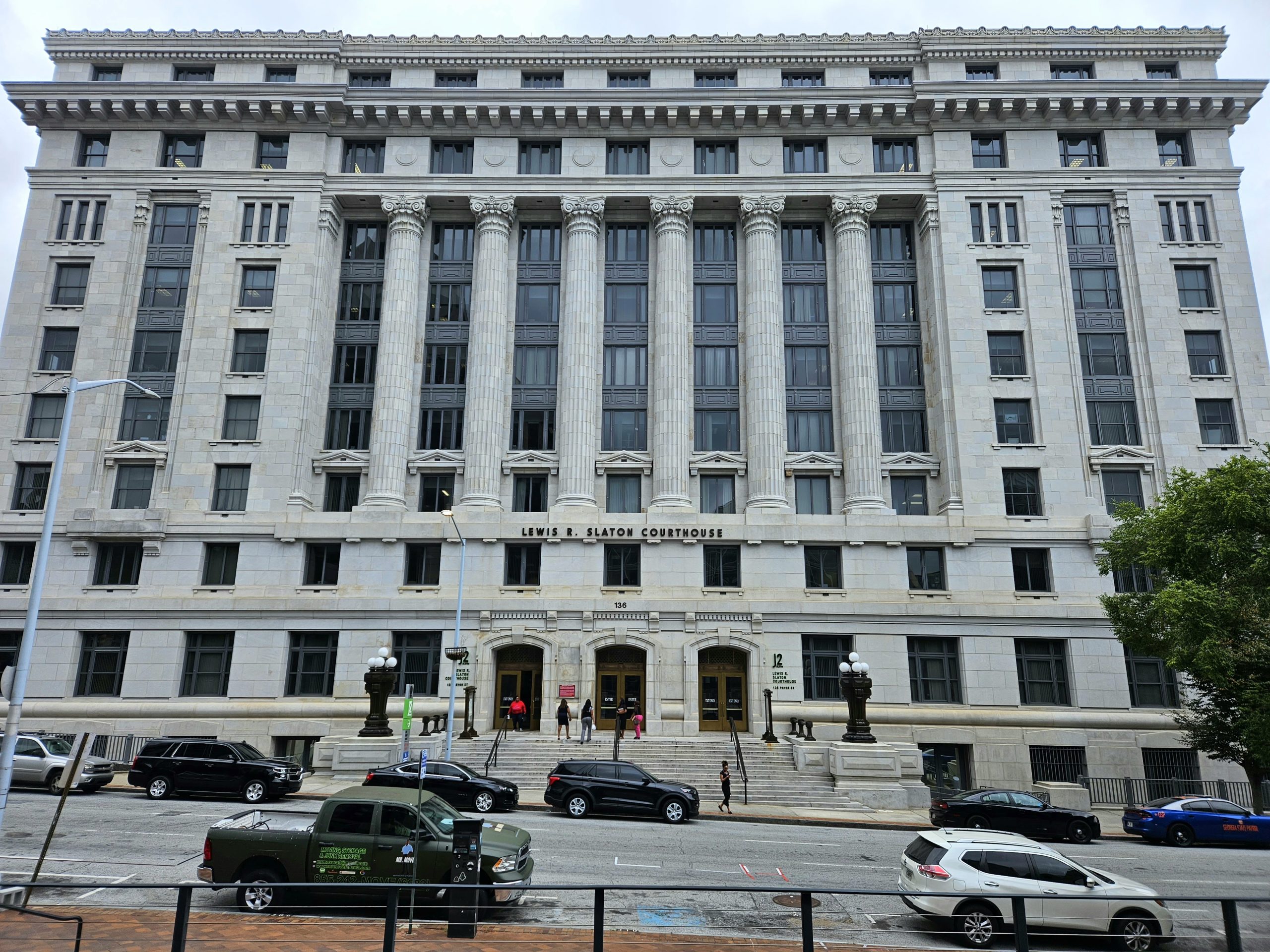 A photgraph of the Fulton County courthouse, a tall grey building with large columns.