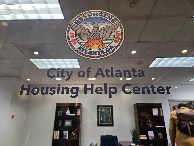 A glass door says, "City of Atlanta Housing Help Center."