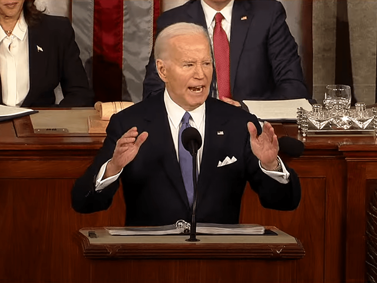A photo of President Joe Biden standing at a podium before Congress.