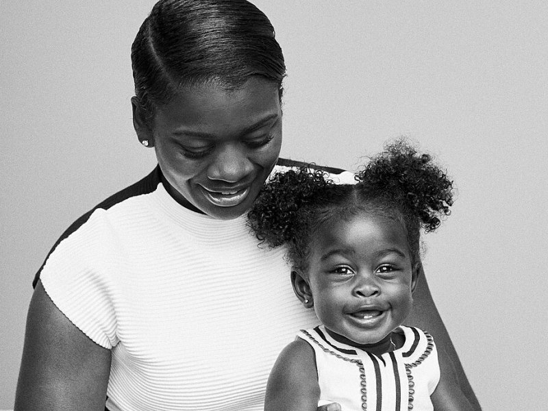 Black mother and child smiling for family picture