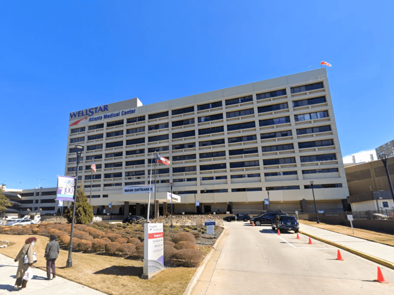 A photo of the Atlanta Medical Center, a beige mid-rise building.