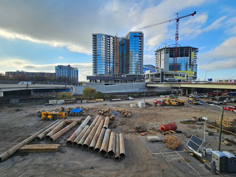 A photo of downtown's desolate Gulch, flanked at the rear by two new glassy towers.