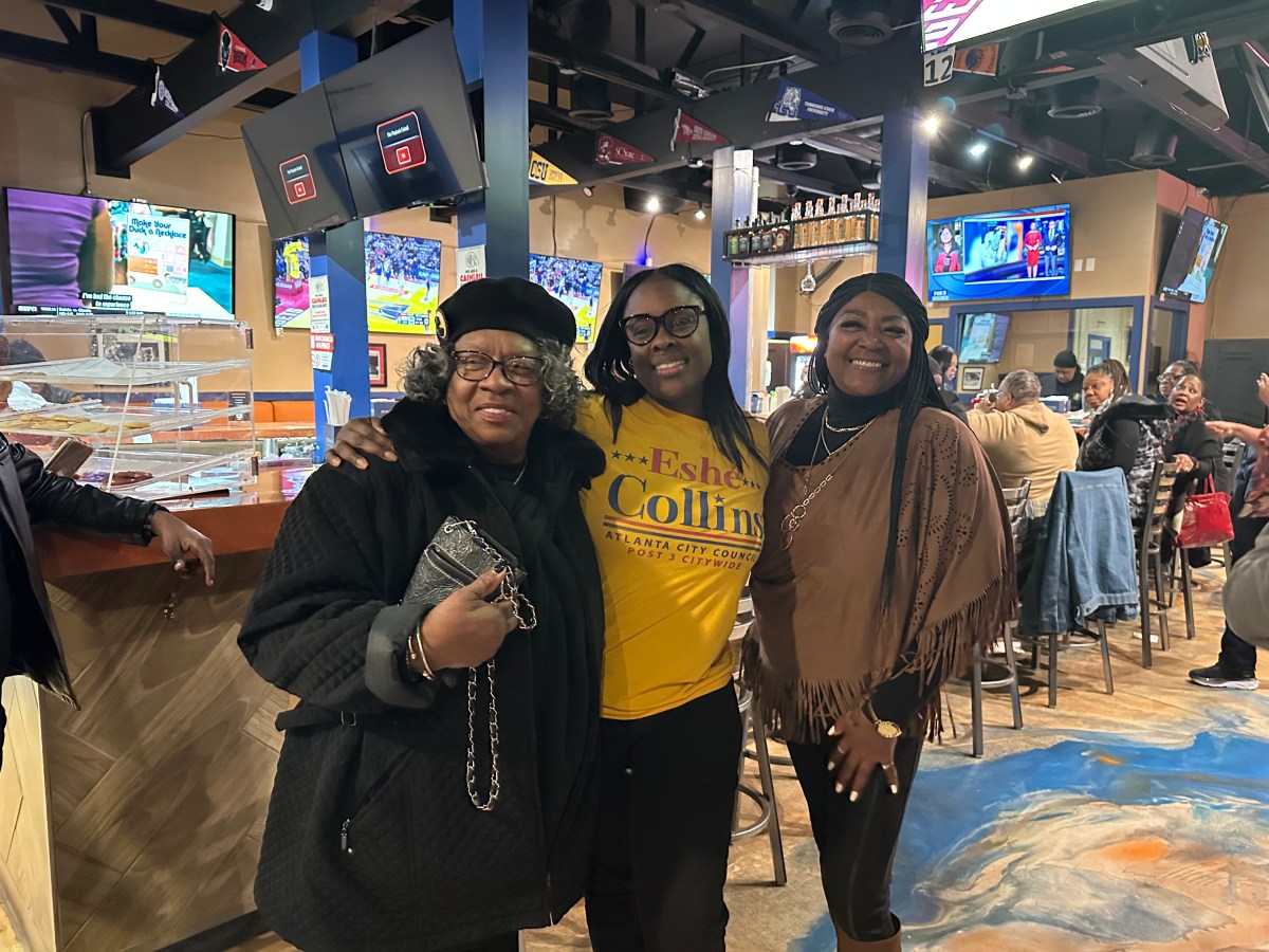 - Eshé Collins with her mother (left), at a J.R. Crickets in Cascade Heights celebrating her runoff election win.