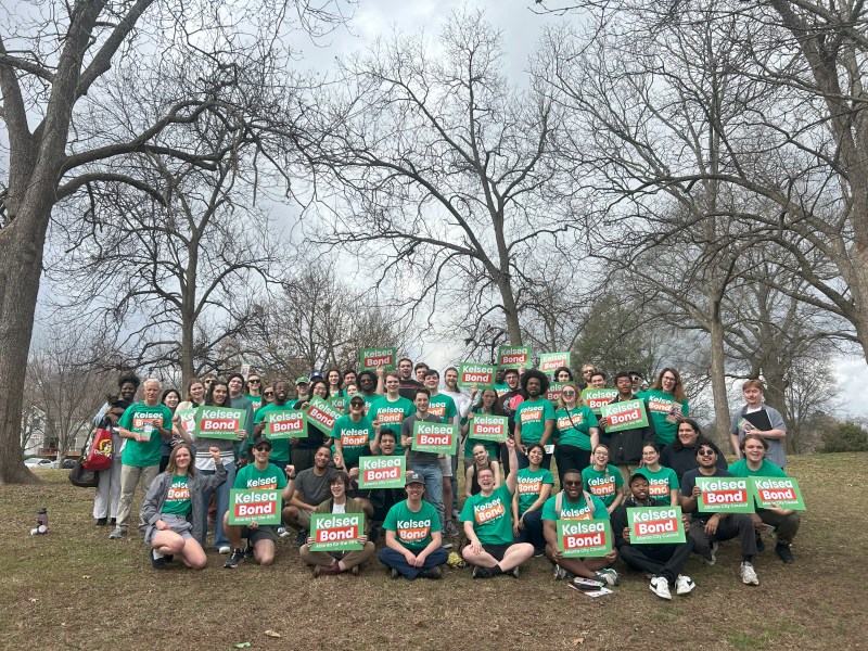 The campaign team of Atlanta City Council candidate Kelsea Bond poses for a photo in an open field