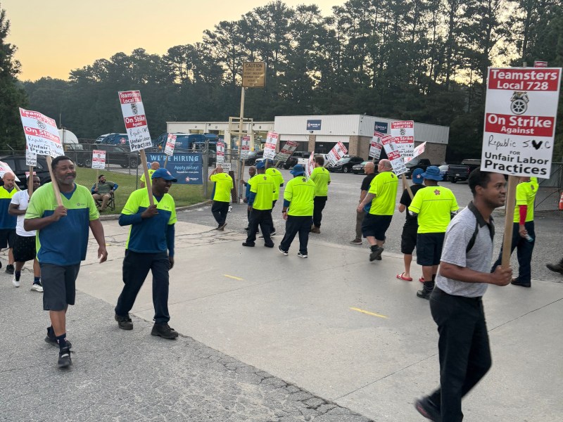 Republic Services garbage collection workers unionized with the Teamster picketing outside the facility in Cumming, Georgia.