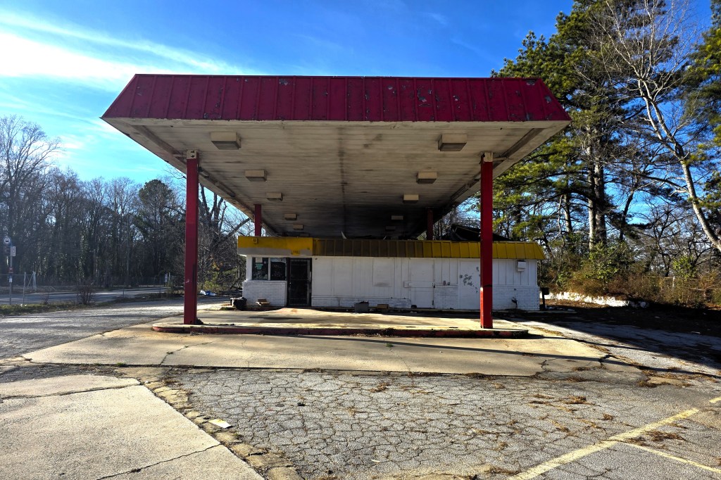 A photo of a run-down gas station.