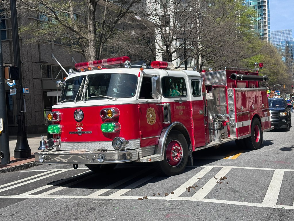 Atlanta firefighters at press conference announcing lawsuit